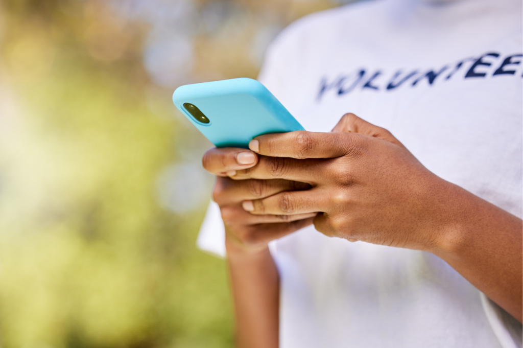 Volunteer using a cellphone